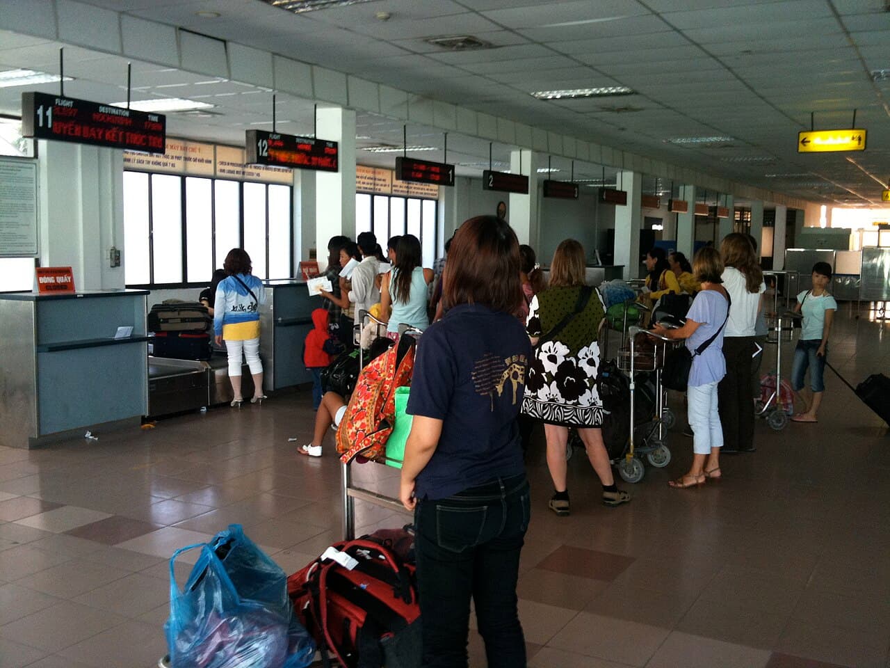 Travellers line up at the check-in counters for Jetstar in the old international departures hall at Da Nang Airport.
